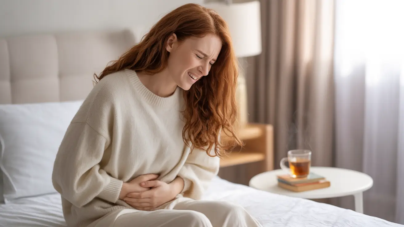 Illustration of a woman in a bright bedroom, sitting on her bed with a pained expression while holding her stomach, representing menstrual nausea, ginger tea visible on bedside table.